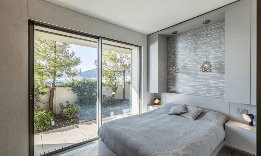 Villa Hotel Alassio in Alassio, Ligurian Riviera, Italy – lush garden and pool deck with sun loungers and coastal vistas
