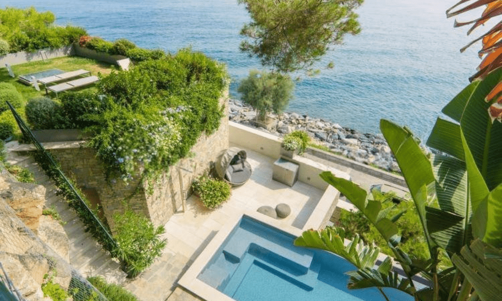 Villa Hotel Alassio in Alassio, Ligurian Riviera, Italy – bright guest suite interior with king-size bed and balcony sea view
