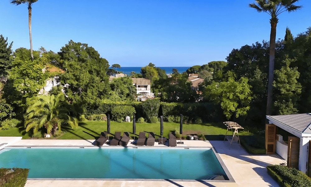 Villa Hotel La Salis in Antibes, French Riviera, France – private courtyard with stone fountain and scented herb garden