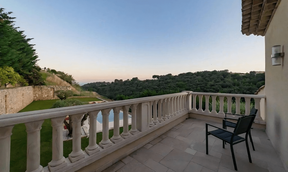 Villa Hotel Galets in Cagnes-sur-Mer, French Riviera, France – private balcony with bistro table overlooking the historic town and azure sea