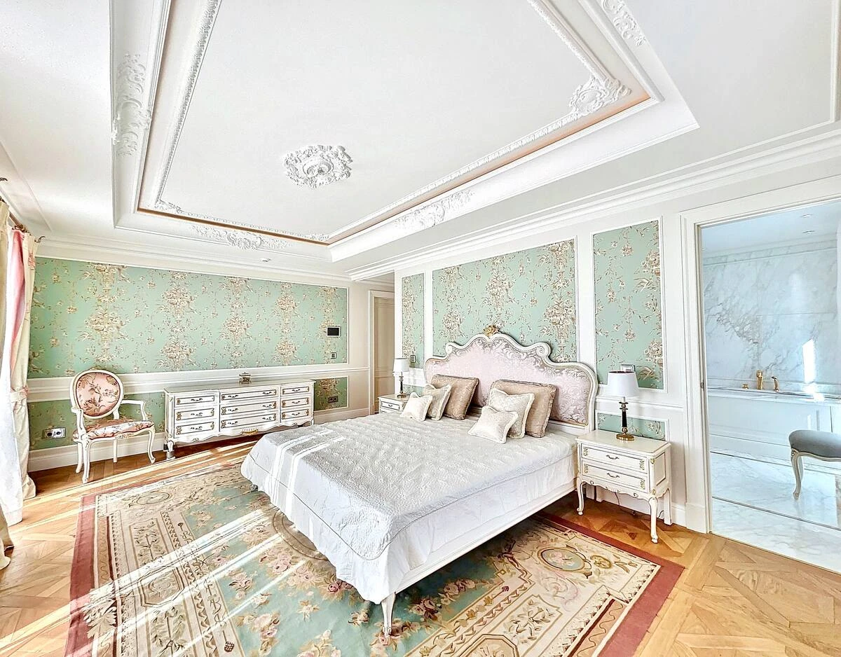 Master suite at Villa Hotel Brougham in Cannes, French Riviera, France – elegant bedroom with king-size bed and private balcony sea view