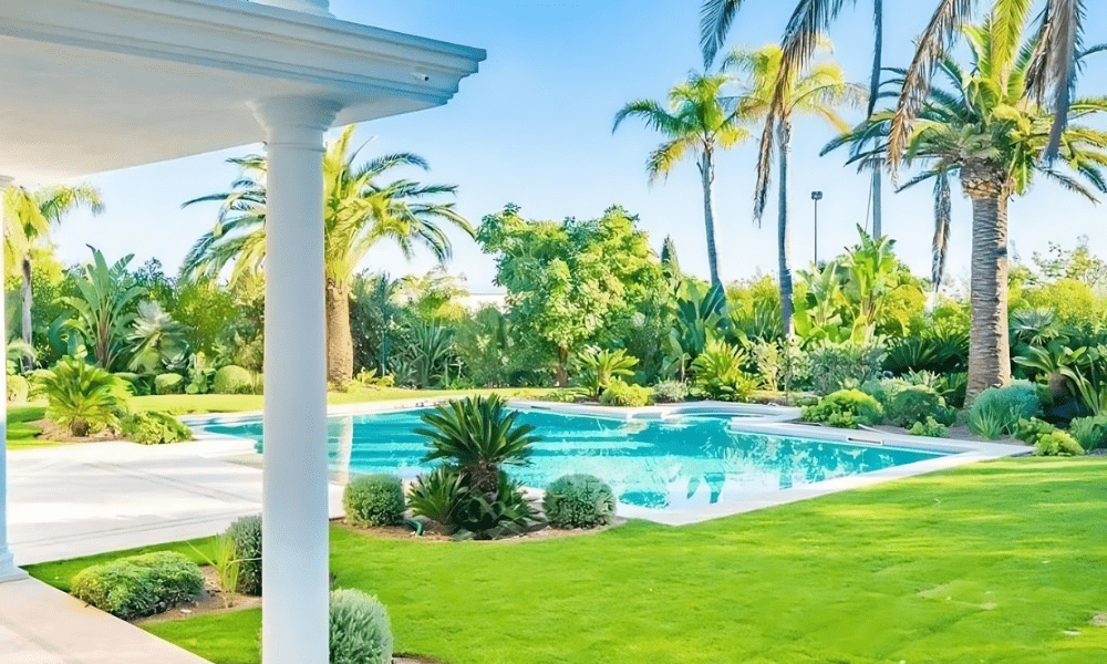 Front façade of Villa Hotel Brougham in Cannes, French Riviera, France – grand entrance with ornate columns and manicured grounds