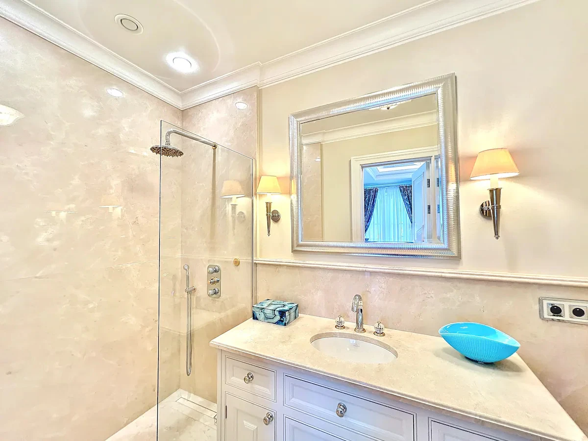 Spa bathroom at Villa Hotel Brougham in Cannes, French Riviera, France – marble-finished bath with freestanding tub and ambient lighting