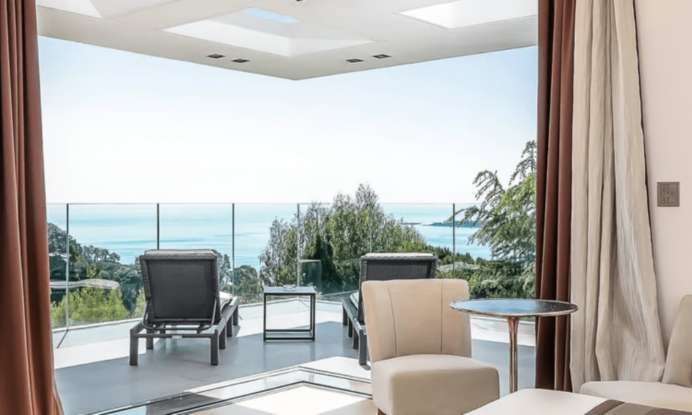 Villa Hotel Californie in Cannes, French Riviera, France – luxurious guest suite with king-size bed and sea-view balcony