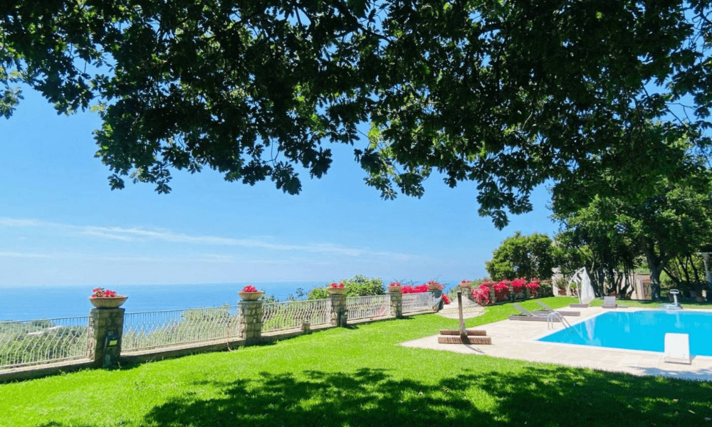 Villa Hotel Anacapri in Capri, Italy – infinity pool terrace with sun loungers and panoramic Mediterranean Sea vistas