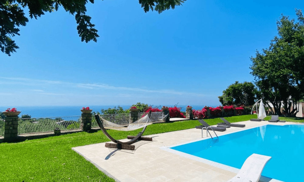 Villa Hotel Anacapri in Capri, Italy – bright guest suite with king-size bed and private balcony overlooking the sea