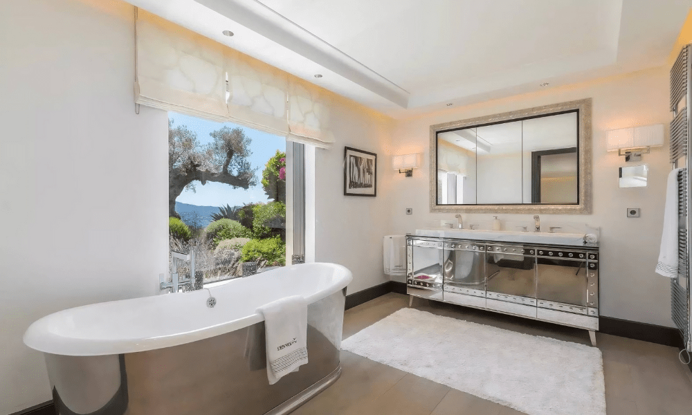 Villa Hotel Bertaud in Grimaud, French Riviera, France – sunset glow over the infinity pool framed by terracotta roof tiles
