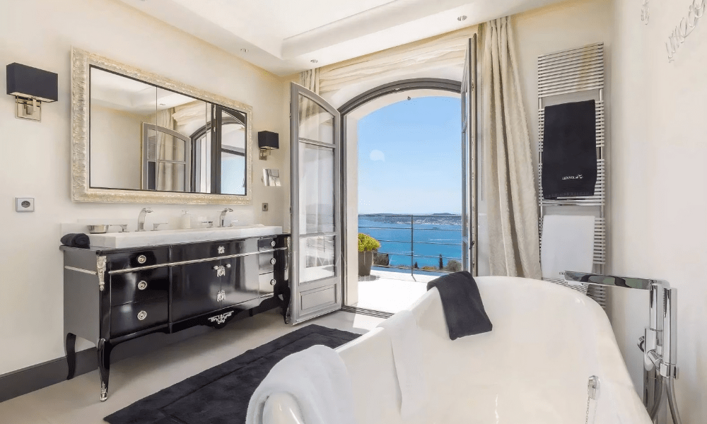 Villa Hotel Bertaud in Grimaud, French Riviera, France – bedroom suite featuring vaulted ceiling, antique furnishings, and serene décor