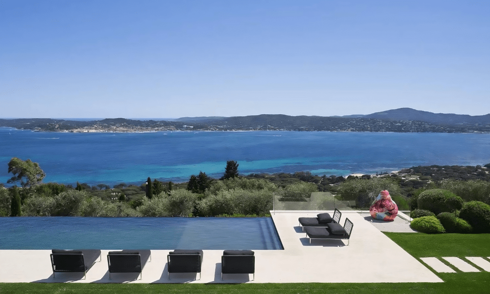 Villa Hotel Bertaud in Grimaud, French Riviera, France – elegant living room with stone fireplace, plush sofas, and contemporary décor