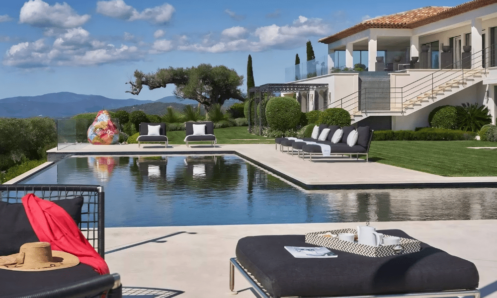 Villa Hotel Bertaud in Grimaud, French Riviera, France – outdoor dining terrace set with rustic wooden table under olive tree canopy