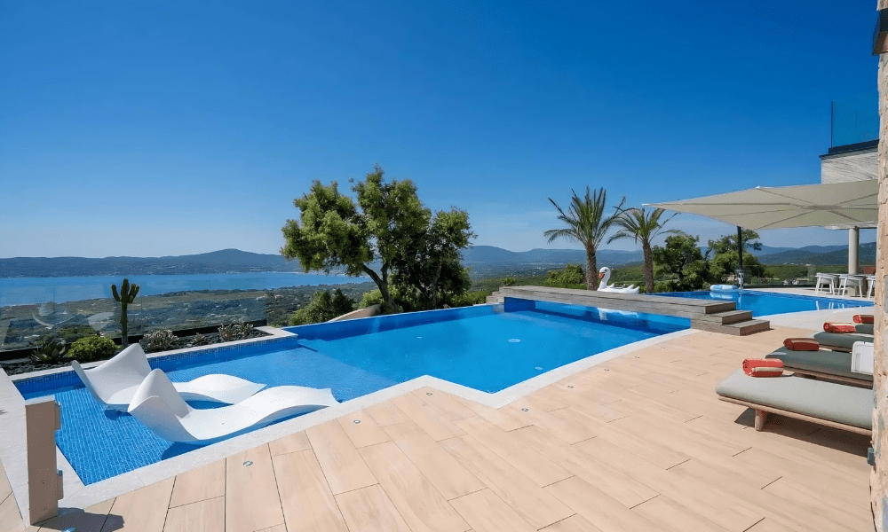 Spacious terrace with sun loungers and panoramic view