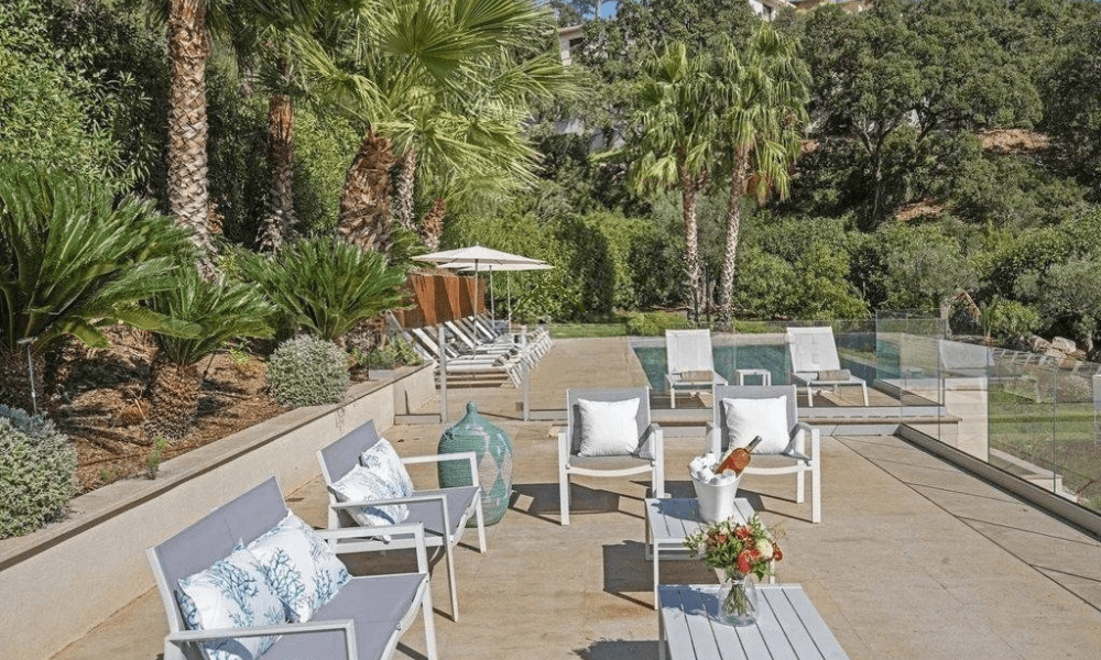 Villa Hotel Grimaud in Grimaud, French Riviera, France – master suite with plush bedding, antique furnishings, and sea-view windows