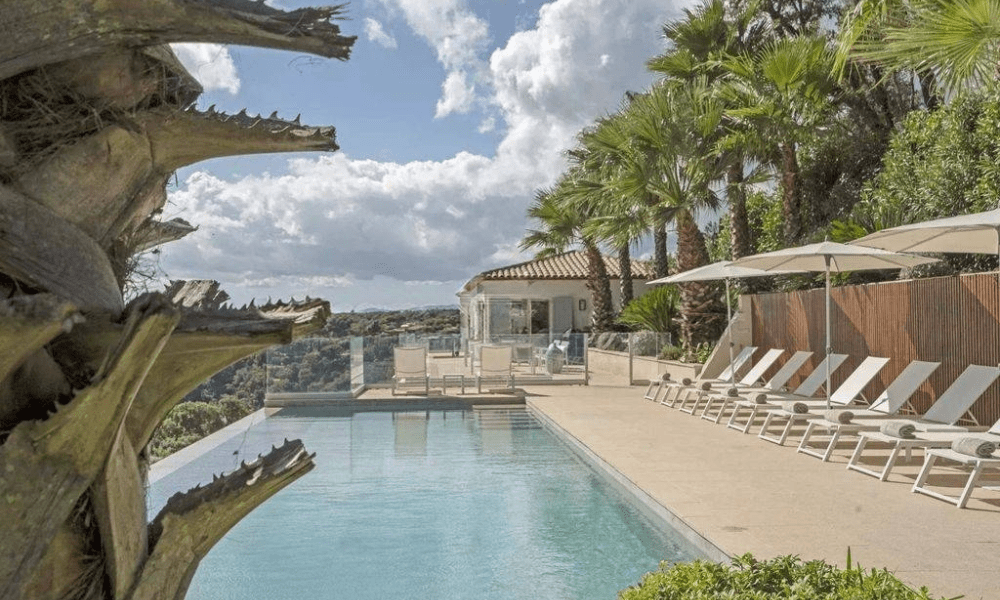 Villa Hotel Grimaud in Grimaud, French Riviera, France – serene outdoor lounge area with wicker seating and olive trees