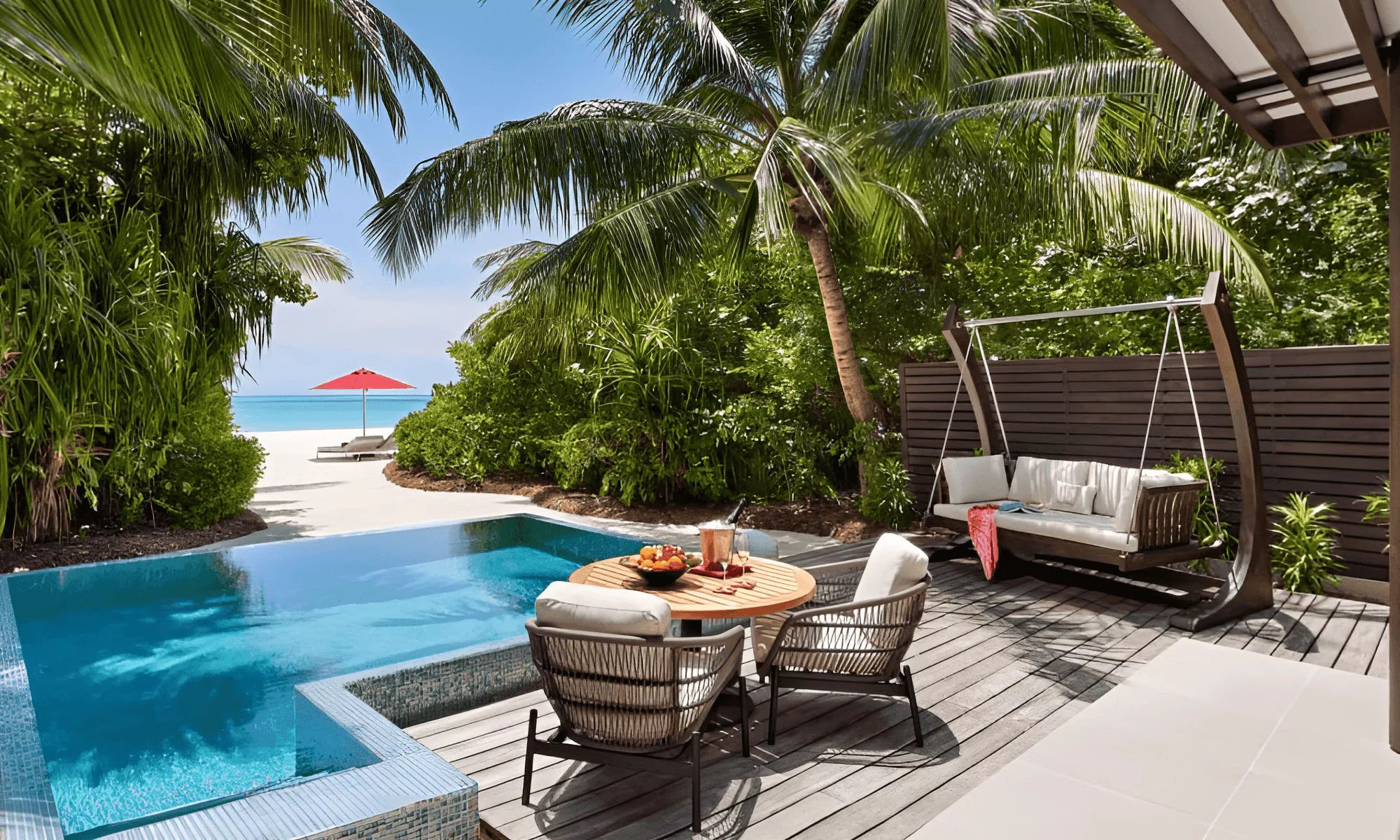 Infinity pool overlooking the turquoise lagoon in Maldives.