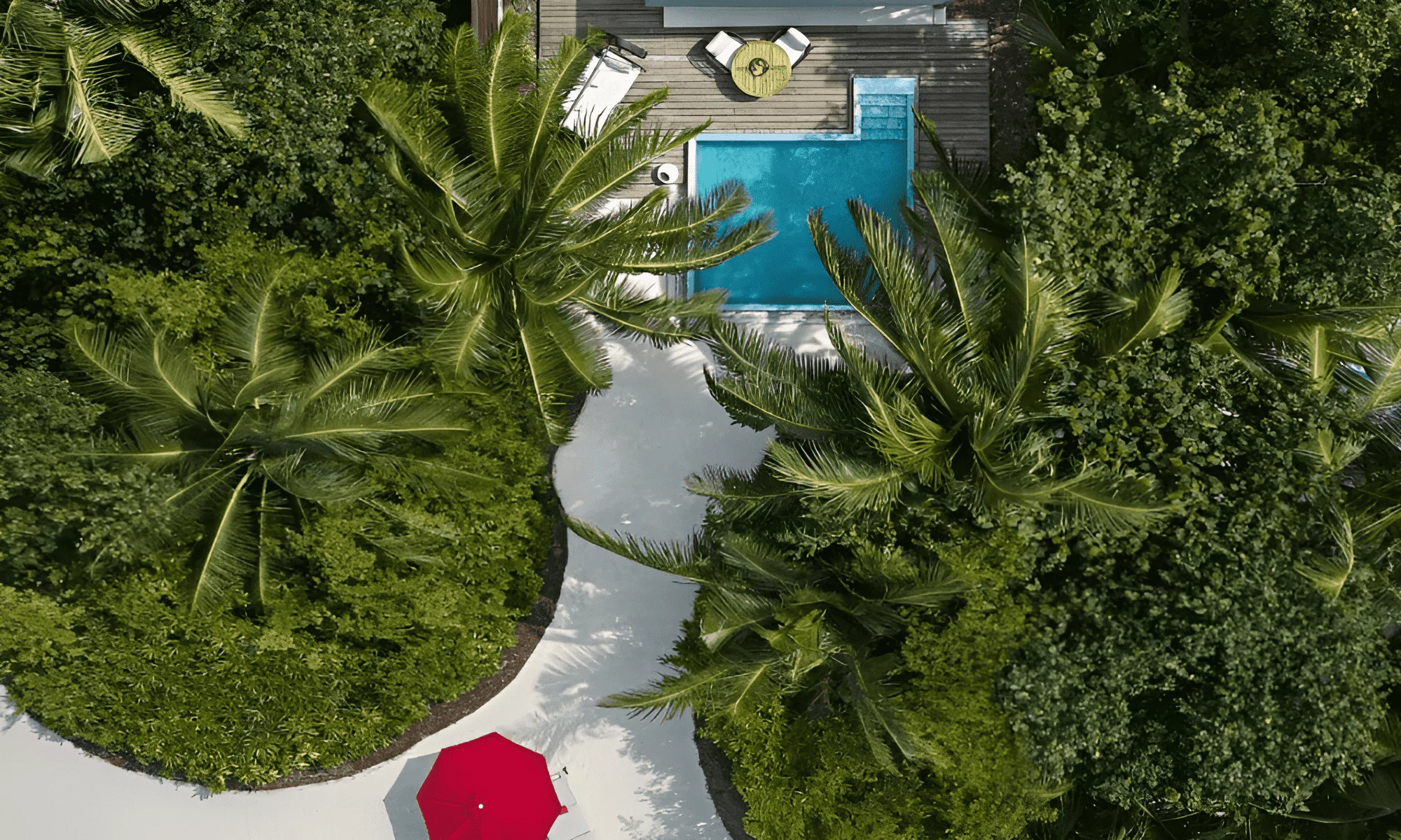 Luxury spa pavilion surrounded by lush tropical gardens.