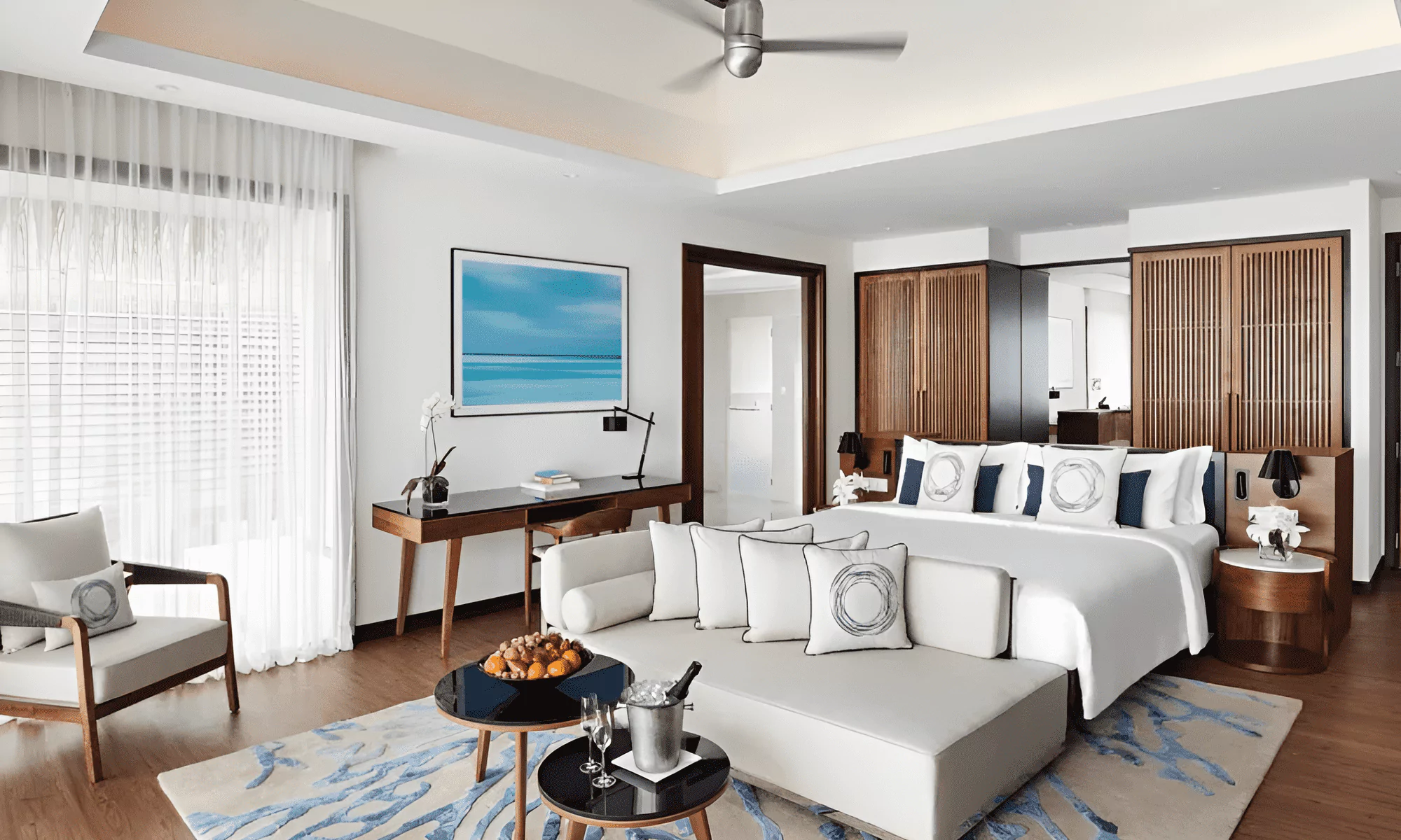 Luxury suite in the Maldives, overlooking the turquoise ocean.