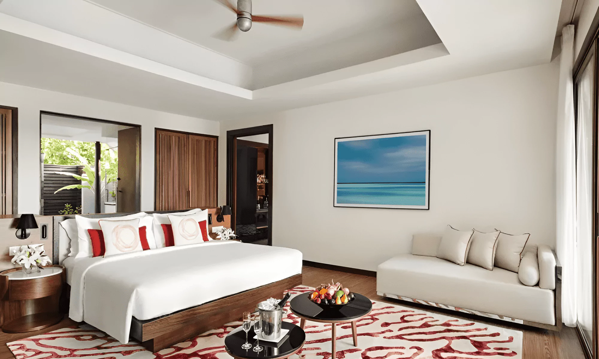 Luxury suite in the Maldives, with fruit and champagne provided.