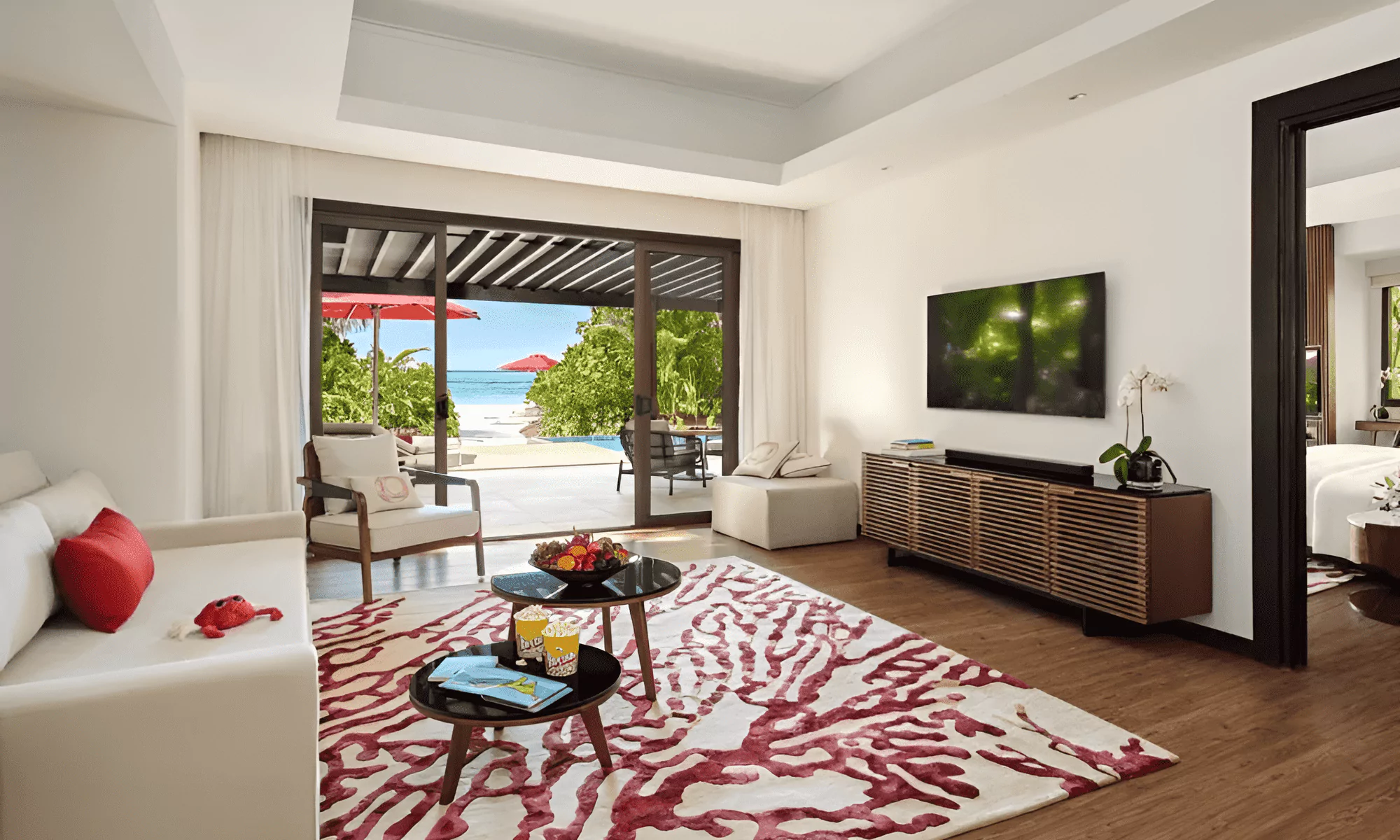 Luxury suite living room in the Maldives, overlooking the ocean.