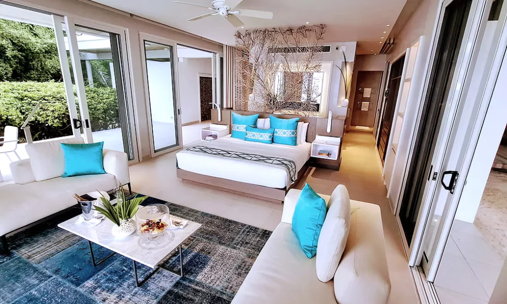 The bathroom of the luxury suite at Villa Hotel, features a modern bathtub.