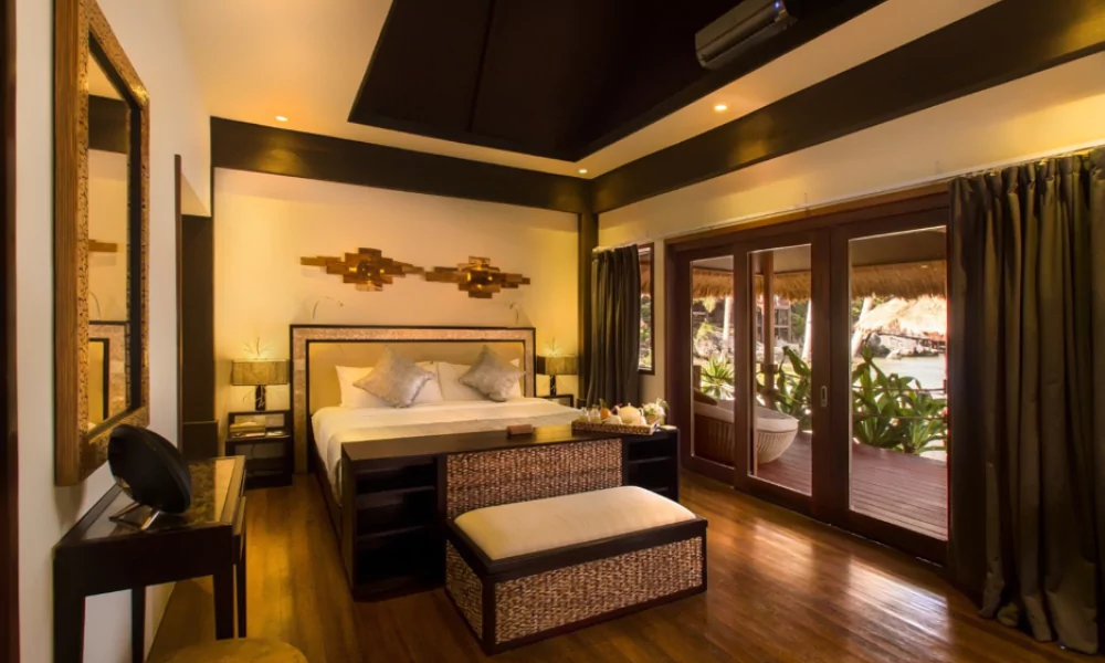 Luxury suite bedroom with views of the Indian Ocean.