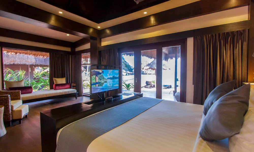 Luxury suite bedroom with views of the Indian Ocean, terrace with private pool.