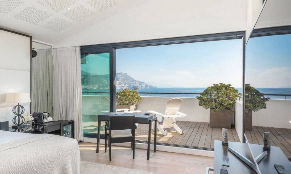 Terrace dining setting overlooking coastal hills