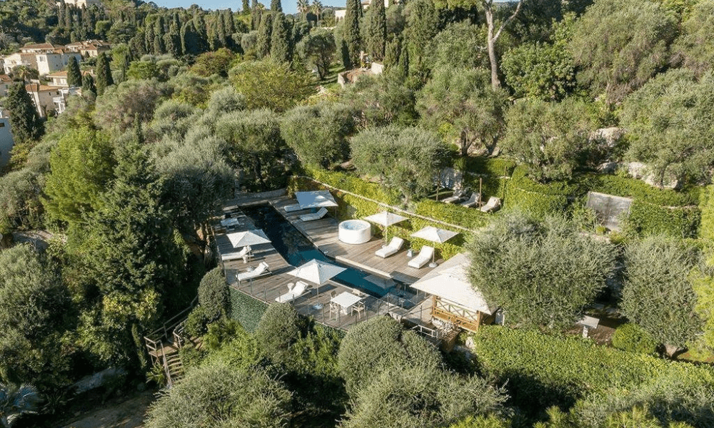 Evening exterior of Colla Blanche villa with soft lighting