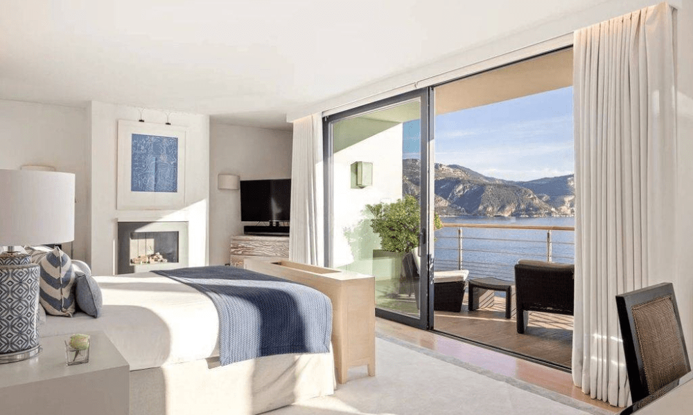 Modern living room interior with panoramic sea-facing windows