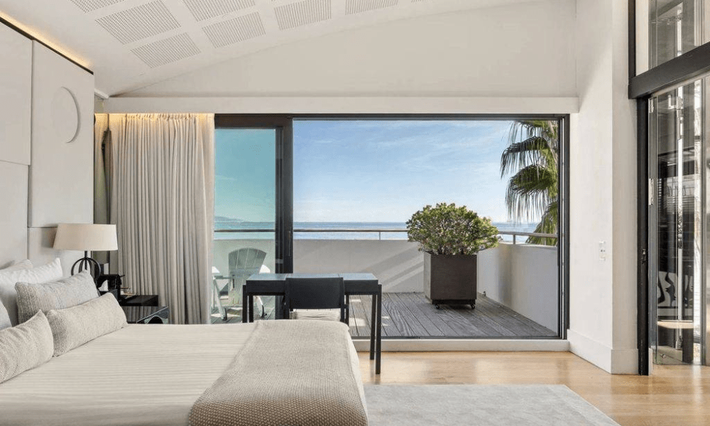 Elegant dining area opening to sea-view terrace