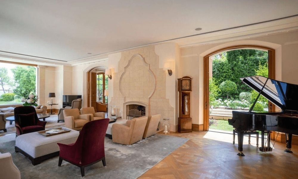 Evening view of villa exterior illuminated by soft lighting