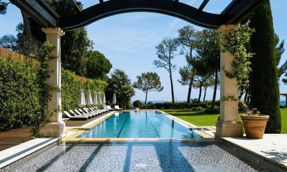 Indoor lounge overlooking landscaped Mediterranean garden