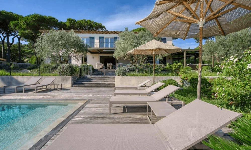 Elegant sun terrace with sea view and lounge seating at Villa Claudine