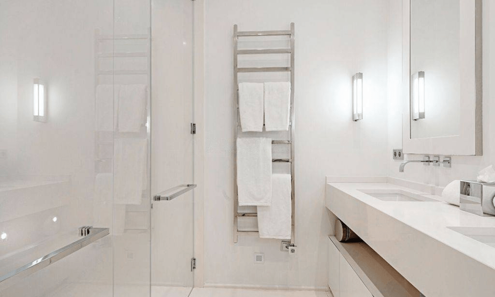 Modern luxury bathroom with high-end fixtures, a large walk-in shower, stylish sink, and elegant marble surfaces.