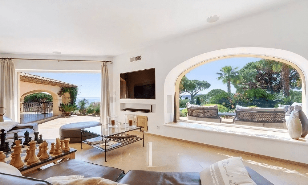 Bedroom interior with decorative artwork and terrace access