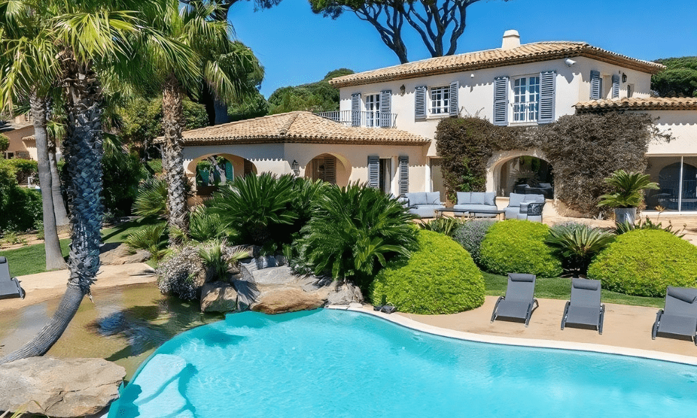 Luxury villa facade in Sainte‑Maxime with Mediterranean backdrop