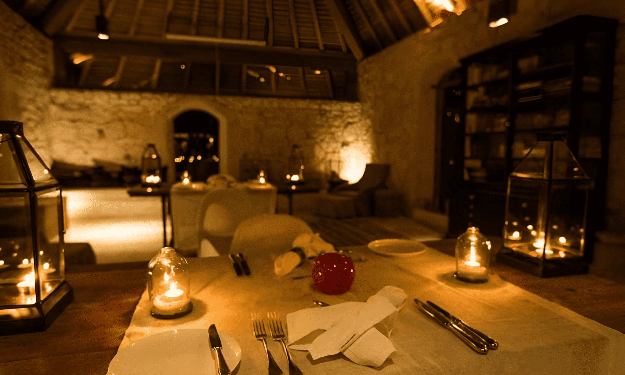 Romantic candlelight dinner on the white sandy shore.