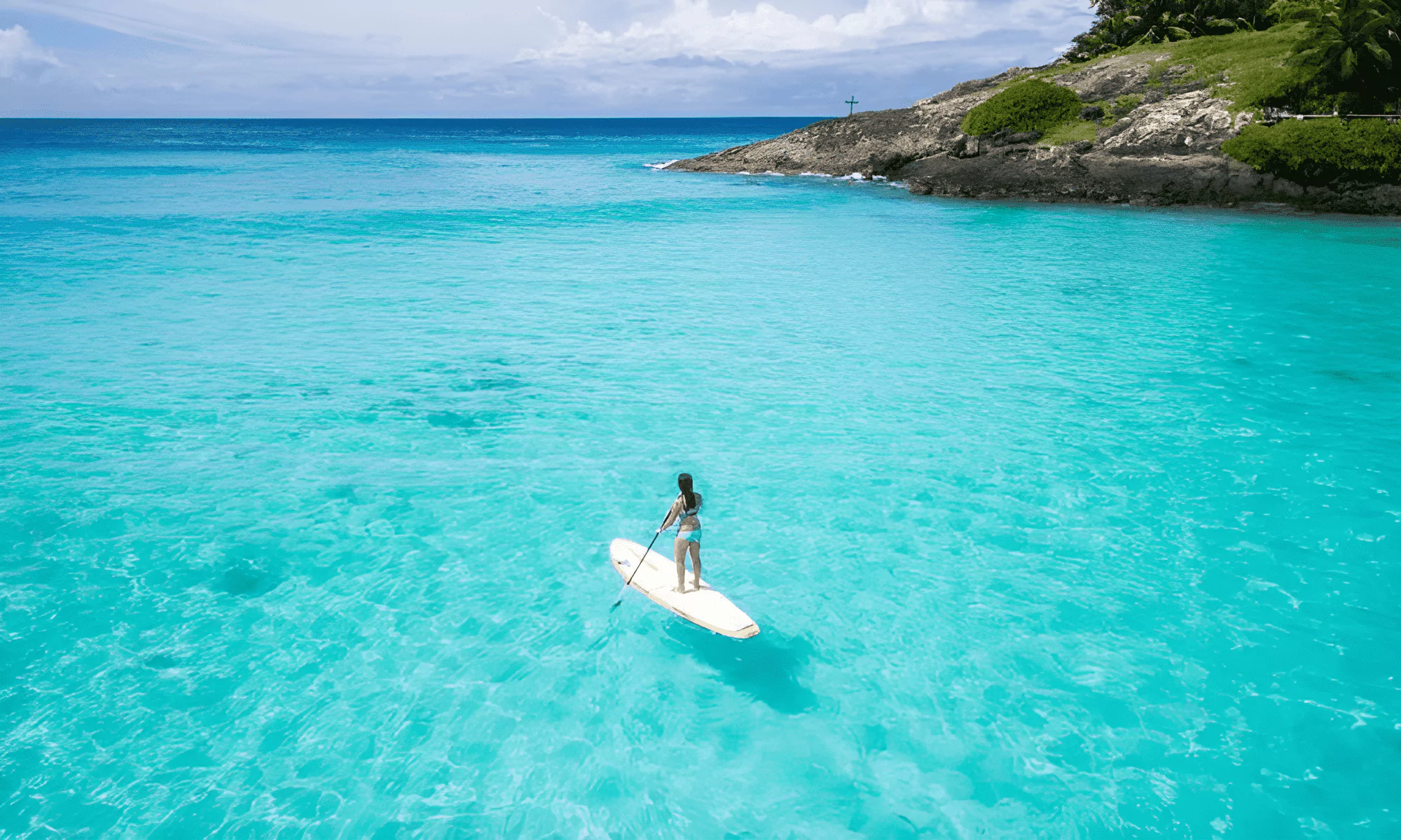 Turquoise ocean with a SUP.