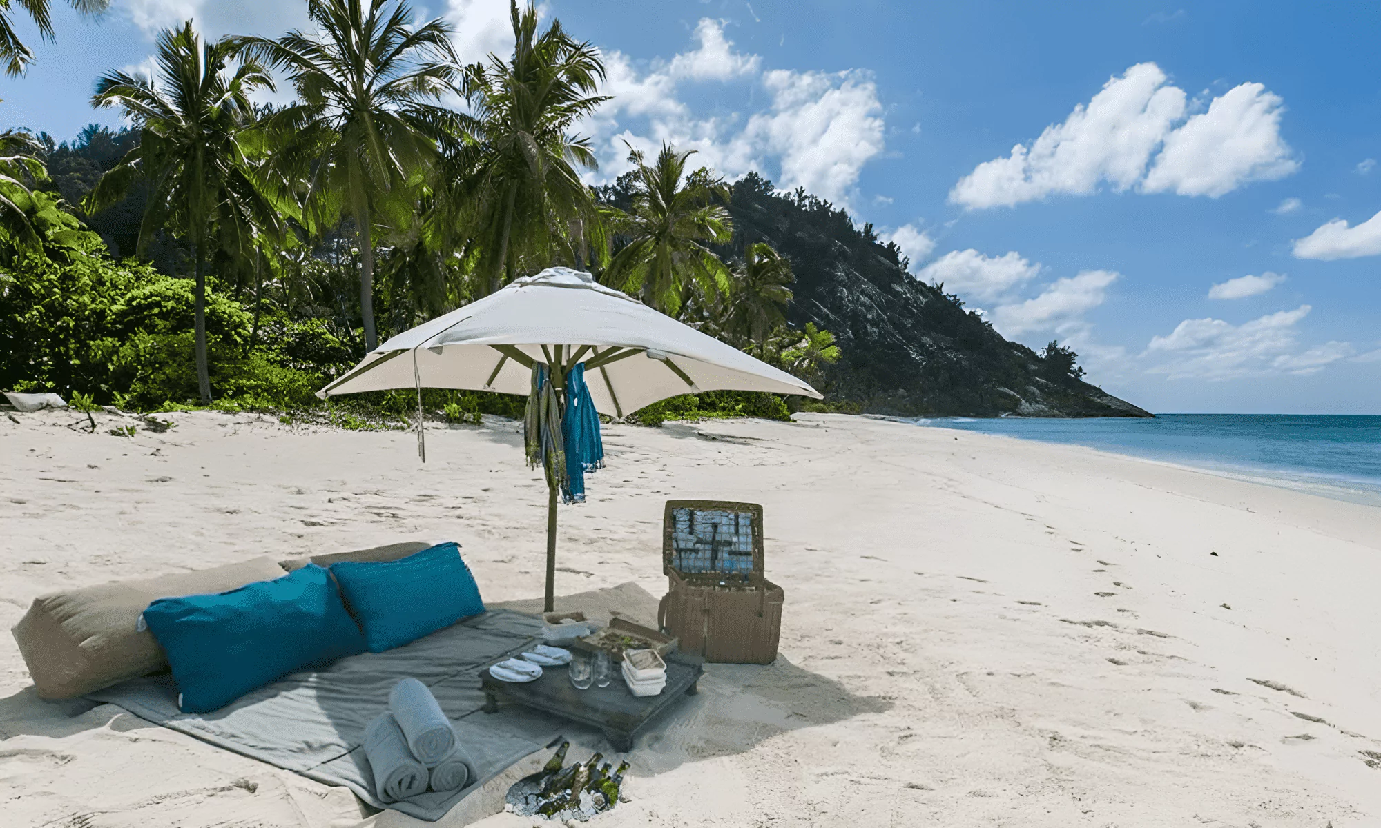 Romantic dinner setup on a private beach in the Seychelles.