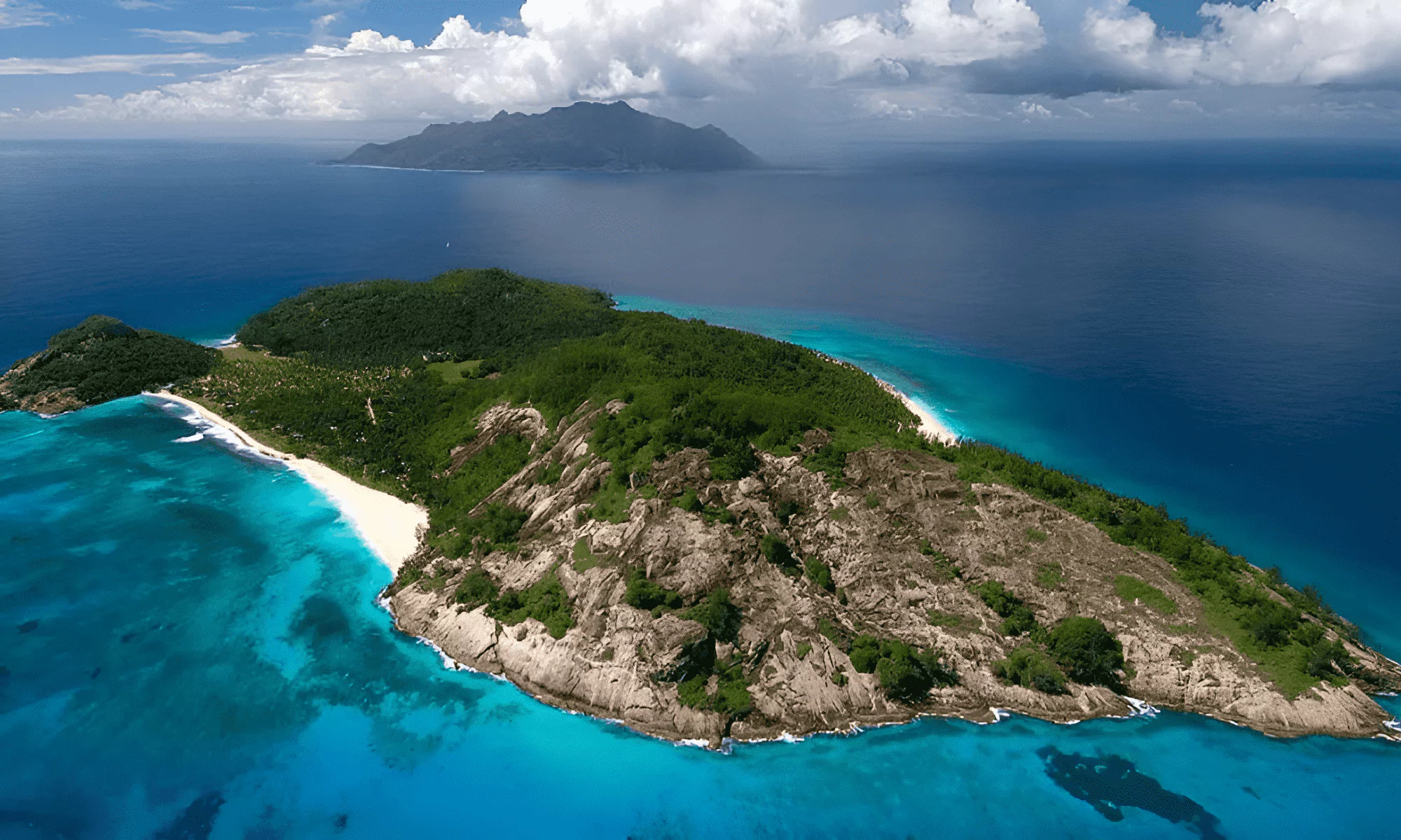 Aerial view of the North Islands, with the white sandy beach in the background.