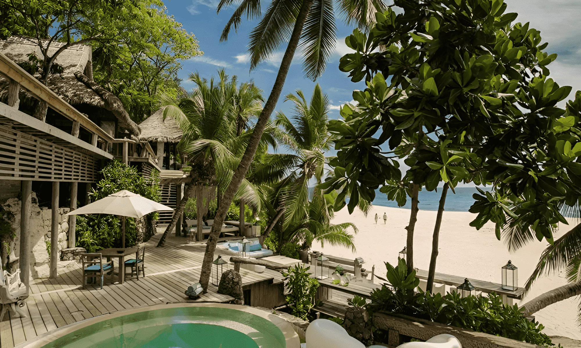 Sandy beach with palm trees on the Seychelles Islands.