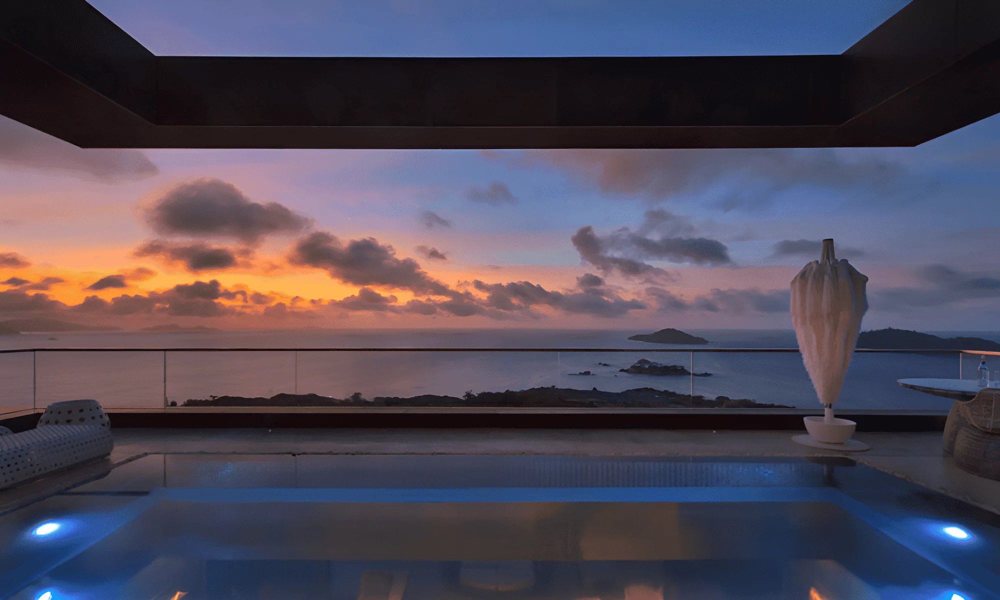 Sunset on the Seychelles Islands, with a light-up pool.
