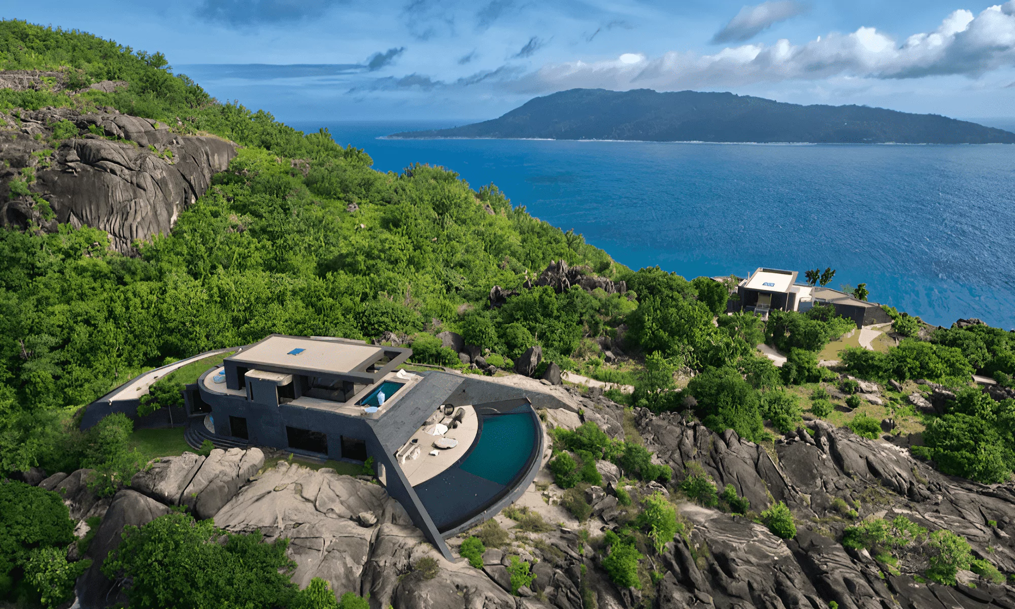 The Villa Hotels building can be seen atop the granite site, overlooking the ocean.