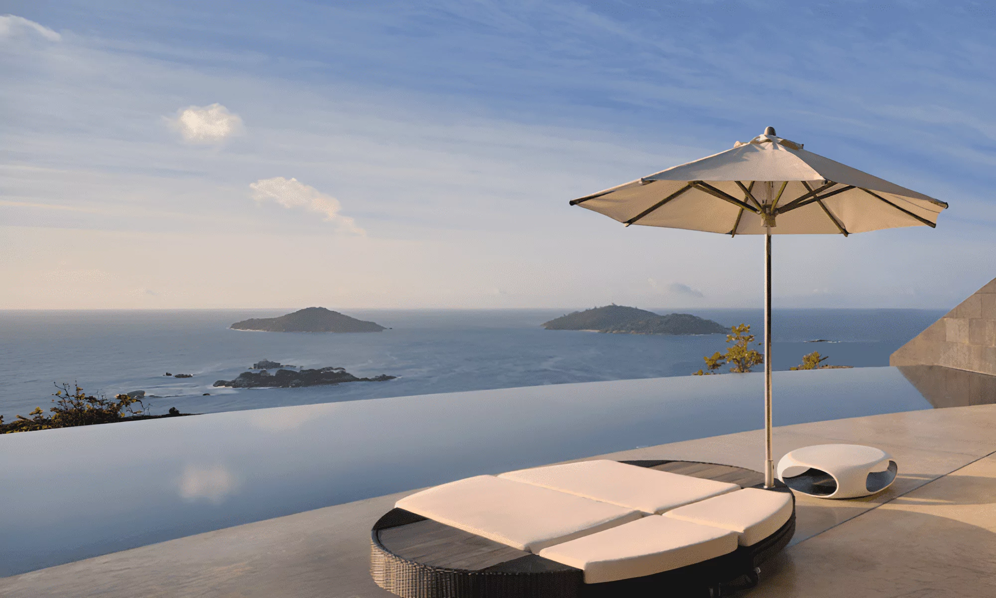 View from the pool to the ocean, with neighboring islands in the distance.