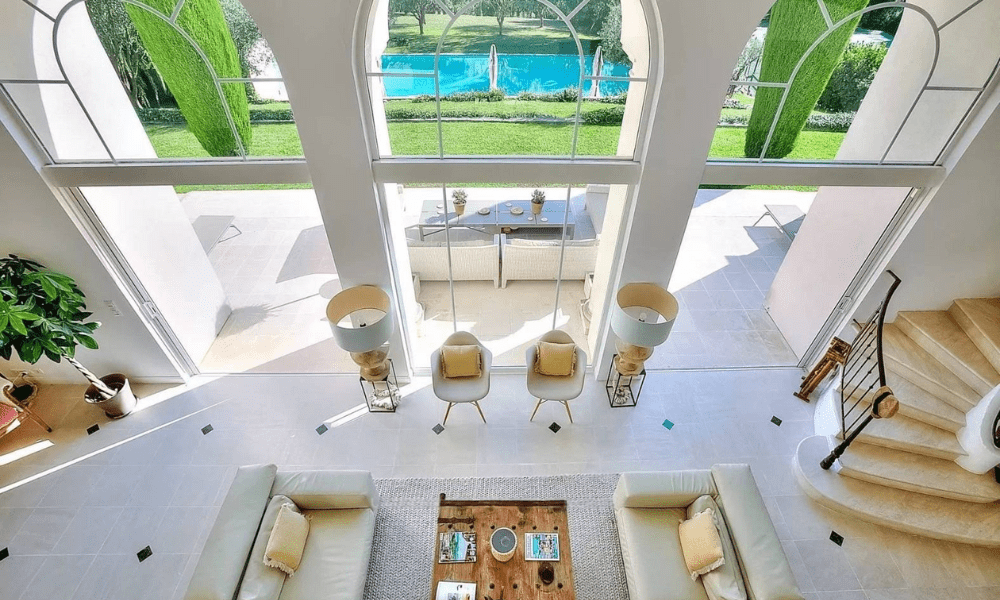 Bright indoor lounge space with garden view
