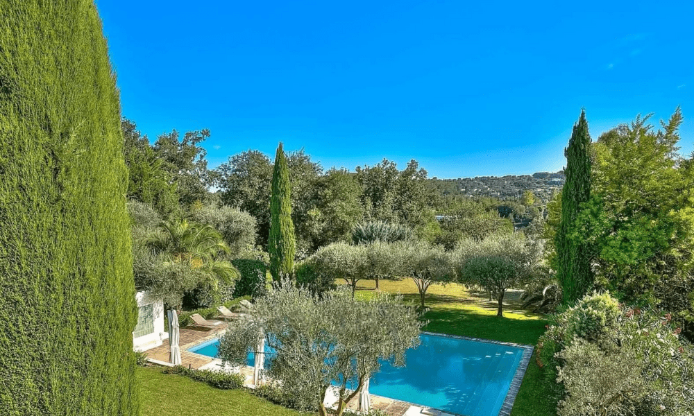 Wide-angle view capturing villa and surrounding countryside