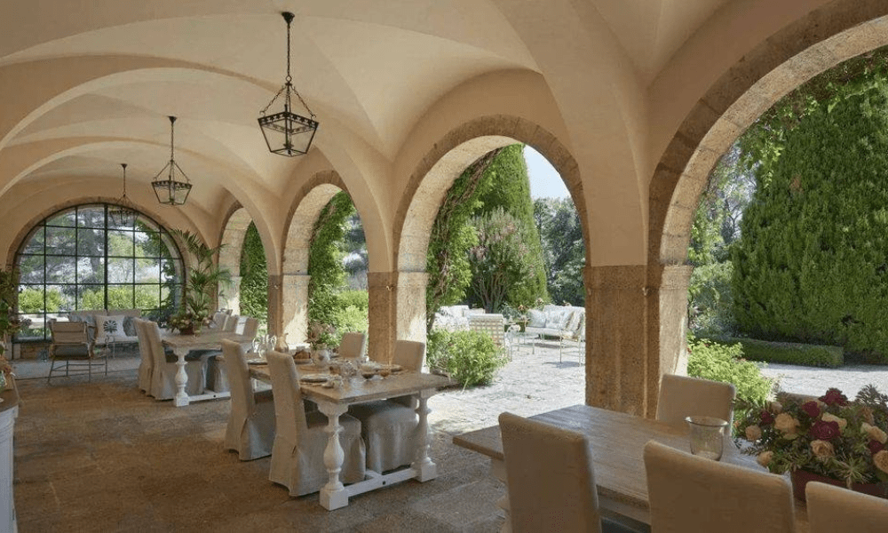 Terrace dining setting with garden and hillside views