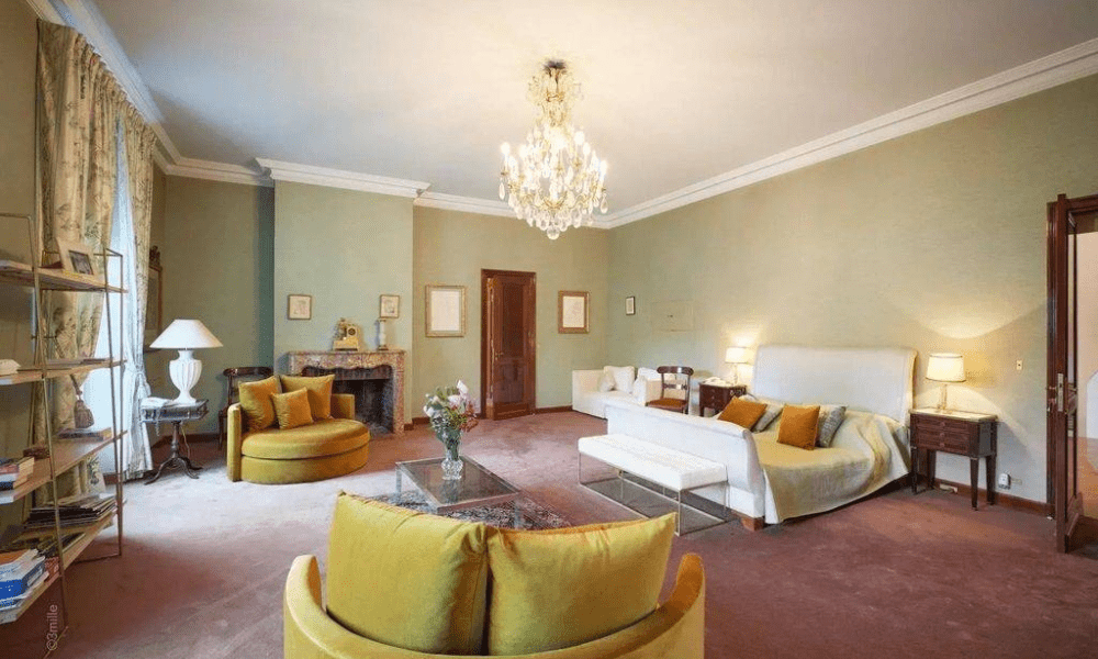 Bright lounge with glass doors opening to garden terrace