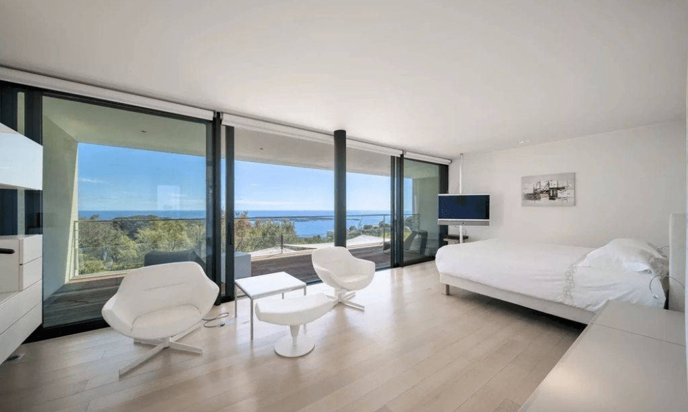 Cozy bedroom suite with terrace access and countryside view