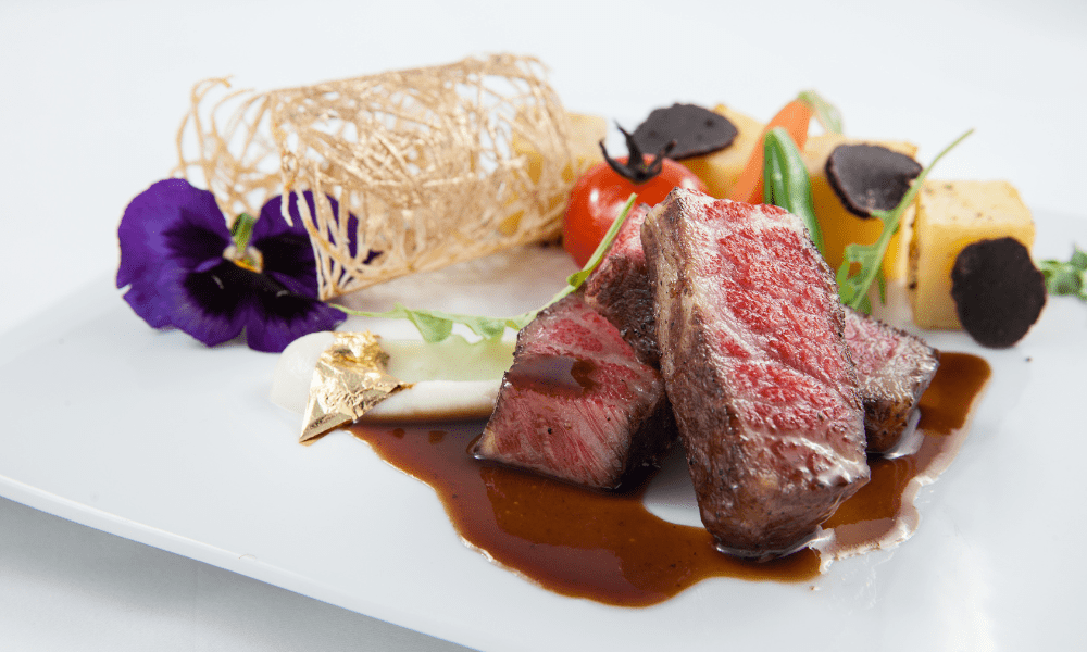 Chef’s seasonal specialty featuring slow-cooked meat with vegetable ragout and fresh herb garnish